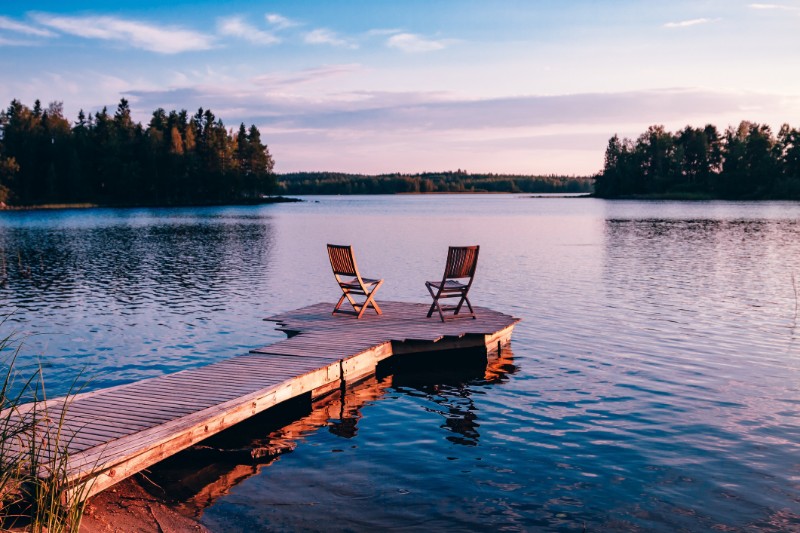 Lake Fishing Dock With Two Wood Chair